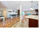 Open dining and living area with hardwood floors and natural light at 4966 Foxrun Ln, Lakeland, FL 33813