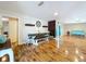Open dining and living area with hardwood floors and natural light at 4966 Foxrun Ln, Lakeland, FL 33813