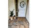 Inviting front entryway with a decorative wreath, stylish lanterns, and welcome mat at 4966 Foxrun Ln, Lakeland, FL 33813
