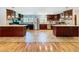 Spacious kitchen features stainless appliances, dual islands, tile floors, and bright lighting at 4966 Foxrun Ln, Lakeland, FL 33813