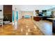 Open living and kitchen area with hardwood floors, natural light, and a breakfast nook at 4966 Foxrun Ln, Lakeland, FL 33813