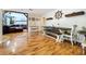 Open concept living and dining area with hardwood floors, and decorative elements at 4966 Foxrun Ln, Lakeland, FL 33813