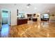 Bright open floor plan showcasing a kitchen with island and living area, creating a welcoming atmosphere at 4966 Foxrun Ln, Lakeland, FL 33813