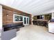 Spacious covered patio with outdoor seating, bar area, and wood accents at 4966 Foxrun Ln, Lakeland, FL 33813