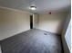 Inviting bedroom with soft carpet, neutral tones, and a well-lit window at 5138 Rock Dove Trl, Lakeland, FL 33810