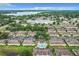 Aerial view shows community pool, landscaping, parking and surrounding area at 519 Sandstone St, Lakeland, FL 33809