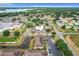 Aerial view of a neighborhood featuring mature trees, a pond, and convenient parking at 519 Sandstone St, Lakeland, FL 33809