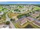 High angle view shows residential complex, parking and road with green landscaping and golf course at 519 Sandstone St, Lakeland, FL 33809