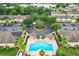 Aerial view showcases a pool and landscaped community with a roundabout at 519 Sandstone St, Lakeland, FL 33809