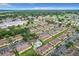 Expansive aerial view of a meticulously planned community with lush landscaping and a sparkling blue community pool at 519 Sandstone St, Lakeland, FL 33809