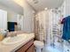 Bathroom features a vanity sink and a shower with a curtain at 519 Sandstone St, Lakeland, FL 33809