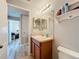 Bathroom featuring vanity, sink, and a heart-themed shelf at 519 Sandstone St, Lakeland, FL 33809