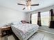 Bedroom features a ceiling fan, and two windows at 519 Sandstone St, Lakeland, FL 33809