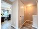 Hallway view of the office with vinyl flooring and neutral paint at 519 Sandstone St, Lakeland, FL 33809