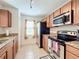 Bright kitchen with granite countertops and stainless steel appliances at 519 Sandstone St, Lakeland, FL 33809