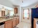 Open kitchen with breakfast bar and stainless steel refrigerator at 519 Sandstone St, Lakeland, FL 33809