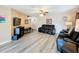 Living room showcasing wood-look floors, comfortable seating, and ample natural light at 519 Sandstone St, Lakeland, FL 33809