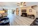 Large living room with wood-look floors, and ample space for seating and entertaining at 519 Sandstone St, Lakeland, FL 33809
