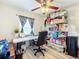 Bright office space with natural light, ceiling fan and zebra striped curtains at 519 Sandstone St, Lakeland, FL 33809