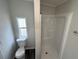 This bathroom has a walk-in shower, a frosted window, and new fixtures at 5217 Turtle Dove Trl, Lakeland, FL 33810