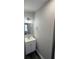 The updated bathroom features a new vanity, a sleek mirror, and modern lighting fixtures at 5217 Turtle Dove Trl, Lakeland, FL 33810