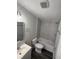A clean bathroom with a shower-tub combination, sleek vanity, and modern fixtures at 5217 Turtle Dove Trl, Lakeland, FL 33810