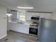 This renovated kitchen has stainless steel appliances, ample counter space, and new cabinets at 5217 Turtle Dove Trl, Lakeland, FL 33810