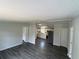 Spacious living area with updated flooring and an open view into the modern kitchen and dining space at 5217 Turtle Dove Trl, Lakeland, FL 33810