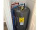 A modern water heater featuring energy efficient design and clearly labeled hot and cold water pipes at 5217 Turtle Dove Trl, Lakeland, FL 33810