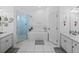 Serene bathroom with dual vanities, a glass-enclosed shower, and a luxurious soaking tub at 5427 Orange Valley Dr, Lakeland, FL 33813