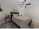 Primary bedroom features a plush queen bed, decor, ceiling fan, and natural lighting at 5427 Orange Valley Dr, Lakeland, FL 33813