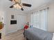 Charming bedroom with a ceiling fan and natural light showcases neutral decor and storage at 5427 Orange Valley Dr, Lakeland, FL 33813