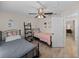 Bedroom includes twin beds, a modern ceiling fan, and decor at 5427 Orange Valley Dr, Lakeland, FL 33813