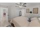 Bedroom features a queen bed, ceiling fan, natural light, and decor at 5427 Orange Valley Dr, Lakeland, FL 33813