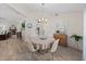 Inviting dining area featuring modern lighting, neutral decor, and an open layout for seamless entertaining at 5427 Orange Valley Dr, Lakeland, FL 33813