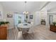 Bright dining room featuring a modern chandelier and neutral decor at 5427 Orange Valley Dr, Lakeland, FL 33813
