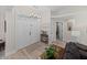 Bright entryway featuring double doors, a transom window, and a stylish chandelier at 5427 Orange Valley Dr, Lakeland, FL 33813