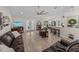 Spacious living room with fireplace, ceiling fan, and comfortable seating area at 5427 Orange Valley Dr, Lakeland, FL 33813