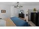 Bright main bedroom with a ceiling fan and an open view to the kitchen and en-suite bathroom at 5427 Orange Valley Dr, Lakeland, FL 33813