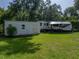 Backyard featuring a well-maintained shed and RV with ample outdoor space at 5427 Orange Valley Dr, Lakeland, FL 33813