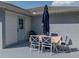 Outdoor patio area featuring a large table and umbrella, perfect for entertaining at 5427 Orange Valley Dr, Lakeland, FL 33813