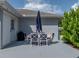 Outdoor patio area with a table, large umbrella, and exterior lighting, great for outdoor dining at 5427 Orange Valley Dr, Lakeland, FL 33813