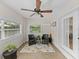 Cozy sun room with tile floors, ceiling fan, and lots of natural light from surrounding windows at 5427 Orange Valley Dr, Lakeland, FL 33813