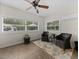 Sunroom with tile flooring, ceiling fan, natural light, and comfortable seating at 5427 Orange Valley Dr, Lakeland, FL 33813