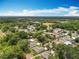 Aerial view of tree lined neighborhood with a playground nearby at 603 Solana St, Lakeland, FL 33813