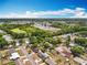 Aerial view of neighborhood surrounded by green spaces with a nearby shopping center at 603 Solana St, Lakeland, FL 33813