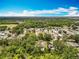 Aerial view of a residential neighborhood with lush greenery and blue skies at 603 Solana St, Lakeland, FL 33813