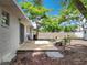 A view of the outdoor wooden deck for seating overlooking the big open back yard at 603 Solana St, Lakeland, FL 33813