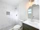 Newly renovated bathroom with tiled shower, modern vanity, and stylish fixtures at 603 Solana St, Lakeland, FL 33813