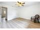 Bedroom with wood-look flooring, ample closet space, and door leading to hallway at 603 Solana St, Lakeland, FL 33813